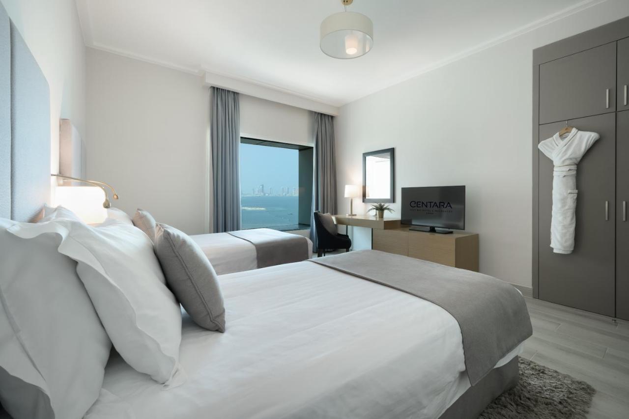 Centara West Bay Hotel & Residences ドーハ エクステリア 写真 A bedroom at the hotel