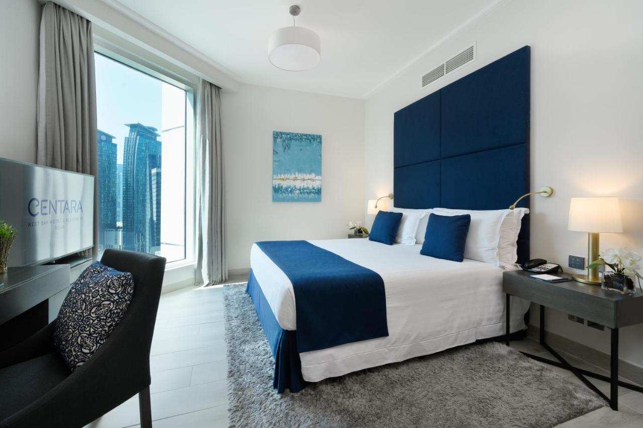Centara West Bay Hotel & Residences ドーハ エクステリア 写真 A bedroom at the Address Downtown Hotel